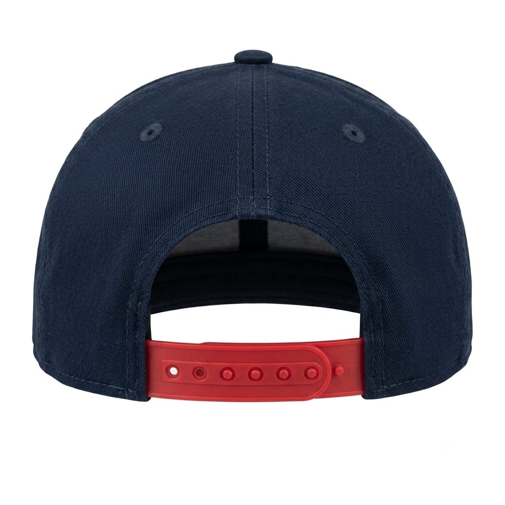 Rear view of a dark navy blue baseball cap with a bright red adjustable snapback strap on a white background.