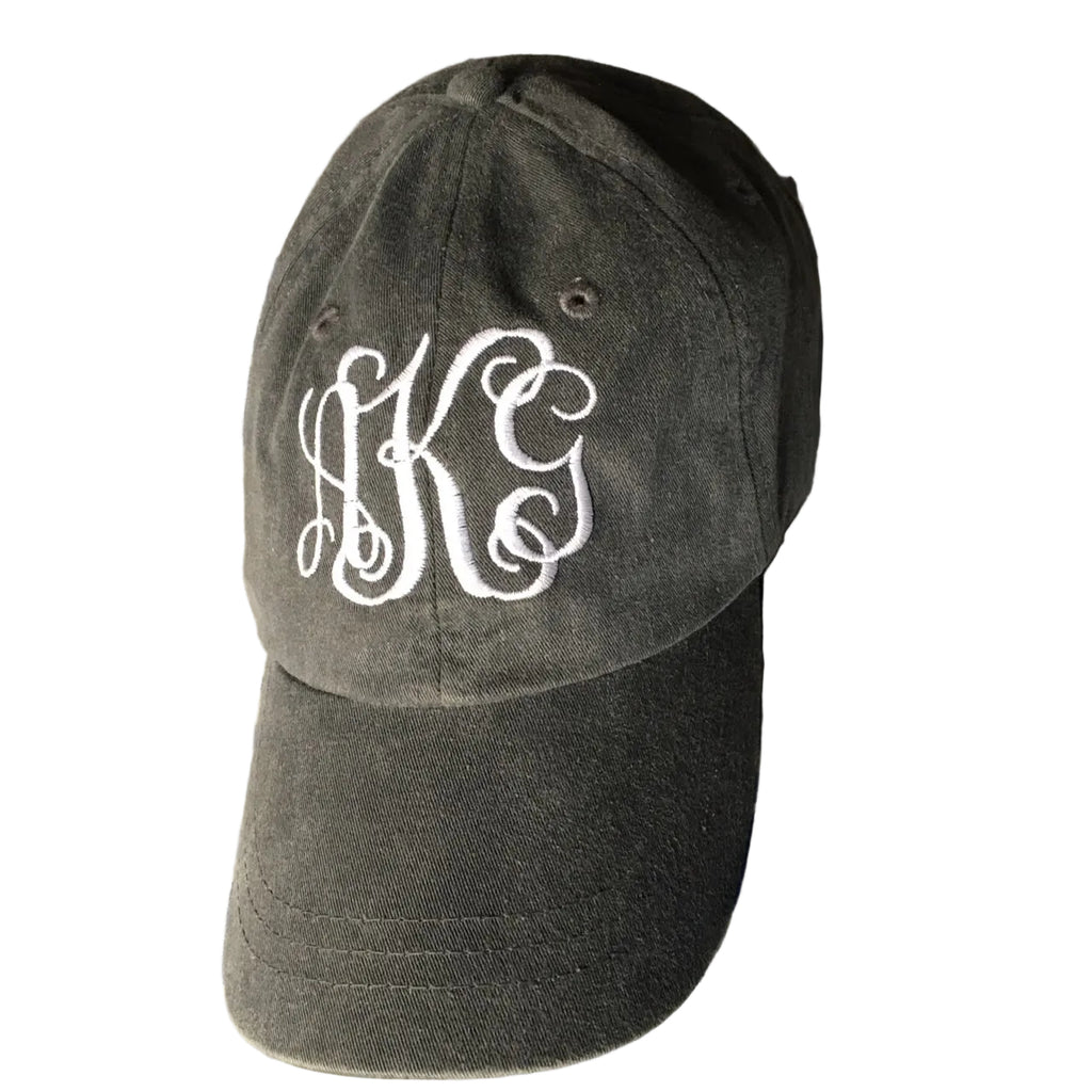 A dark gray cotton baseball cap with white embroidered monogram letters 'HKS' on the front.