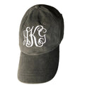 A dark gray cotton baseball cap with white embroidered monogram letters 'HKS' on the front.