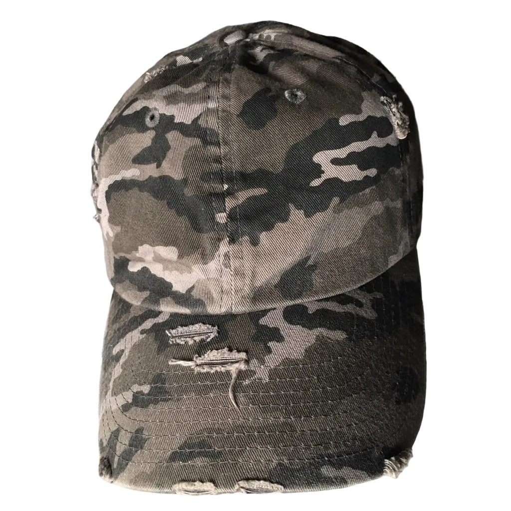 A distressed baseball cap with a gray, black, and beige camouflage pattern, featuring ripped details on the brim.