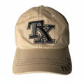 A beige baseball cap with a large embroidered 'TX' logo on the front and 'TEXAS' stitched on the brim.