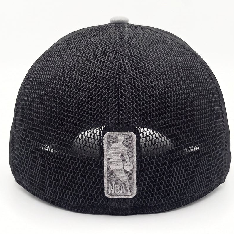 A four-view product photo of a New Era 9FORTY trucker cap in black and gray. The views show the front/side, back, and rear strap of the cap on a clean white background.